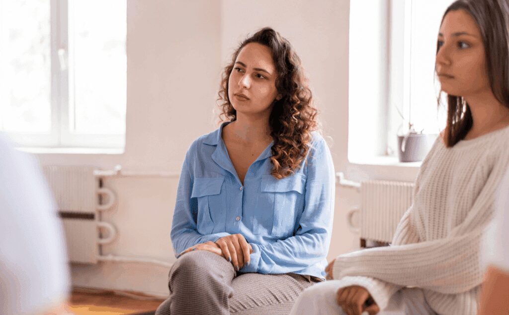 women sitting hearing the good news