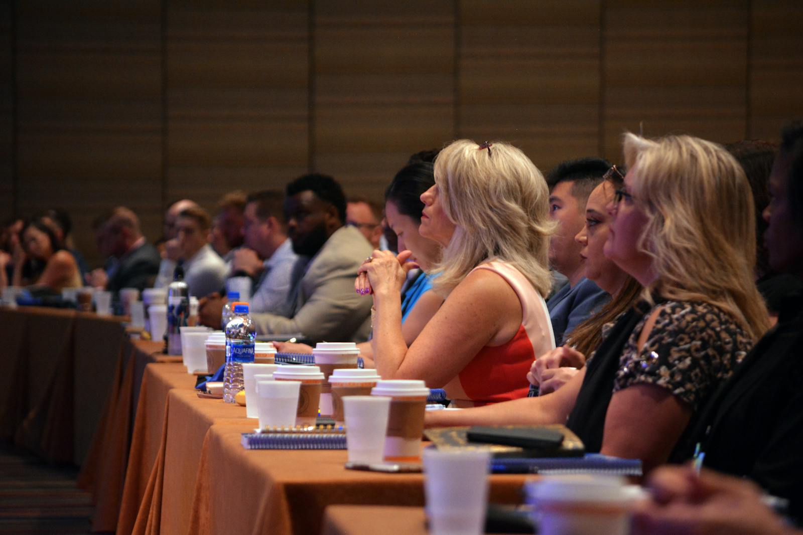 Workers Compensation Services worker compensation services professionals getting training during a conference session in a meeting room.